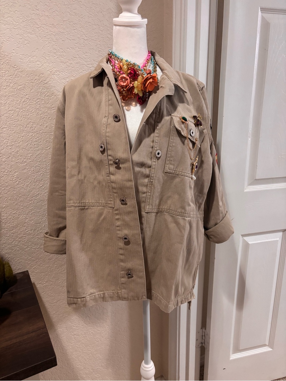 Embellished Beige Utility Jacket with Decorative Patches and brooches Retail$280